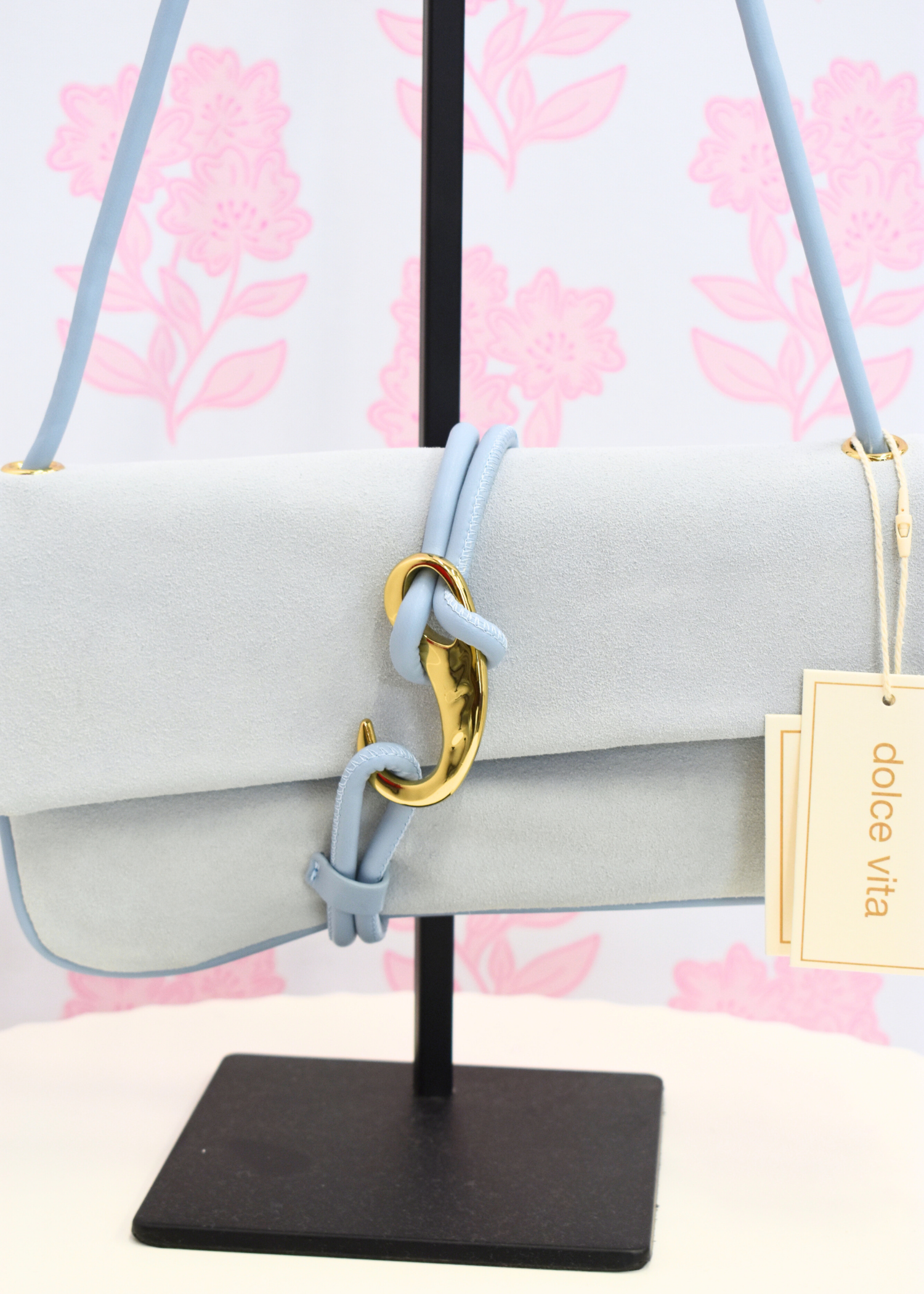 Suede shoulder bag with hook closure and compact shape
