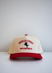 Front view of American Cowboy red and natural vintage trucker hat