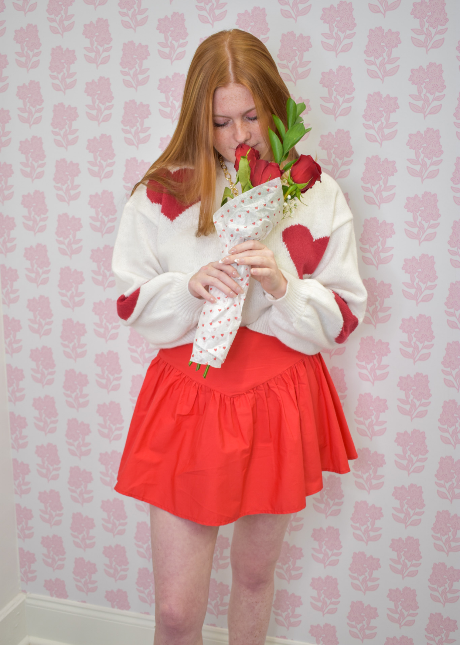 Effortless cream sweater with red hearts for cozy seasonal outfits