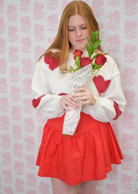 Classic cream sweater with red hearts and soft knit texture