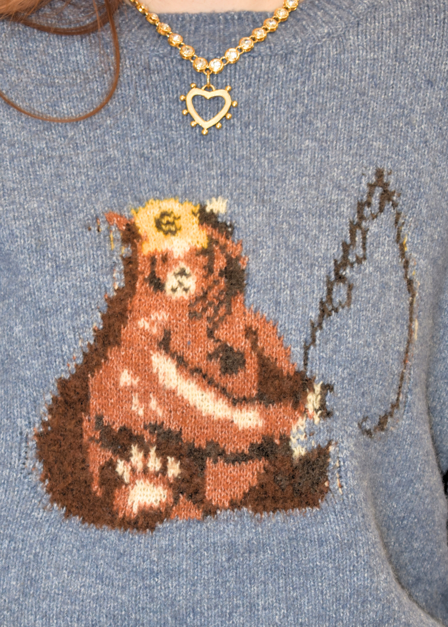 Close up of knit design with bear fishing