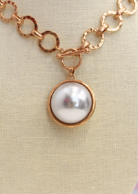 Elegant gold pearl pendant necklace styled for everyday wear