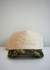 Front view of Bitchin embroidery on natural trendy trucker hat