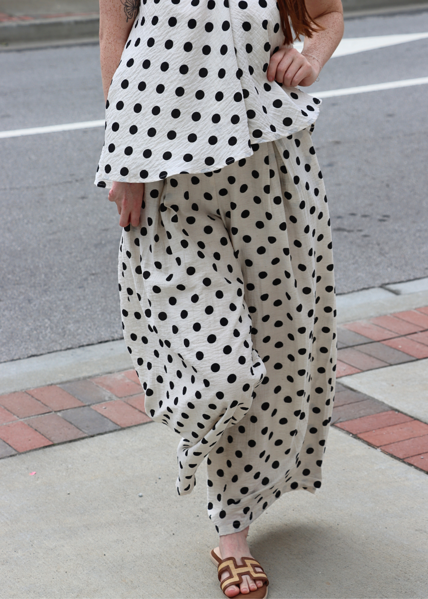 Close up of polka dot print on lightweight linen pants