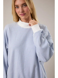 Blue cream striped mock neck sweatshirt styled with matching striped shorts