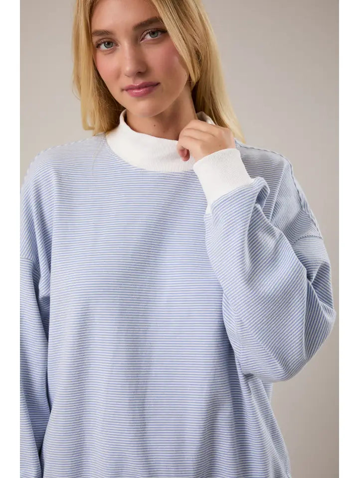 Blue cream striped mock neck sweatshirt styled with matching striped shorts