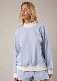 Front view of blue and cream striped mock neck sweatshirt top for women