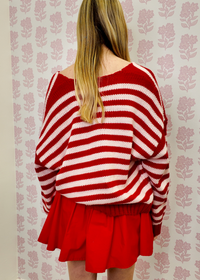 Effortless pink and red striped v neck sweater for casual outfits