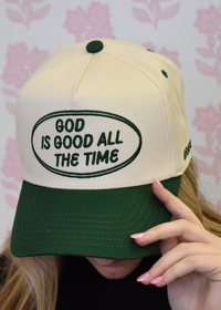 Back view of green trucker hat with breathable mesh panel