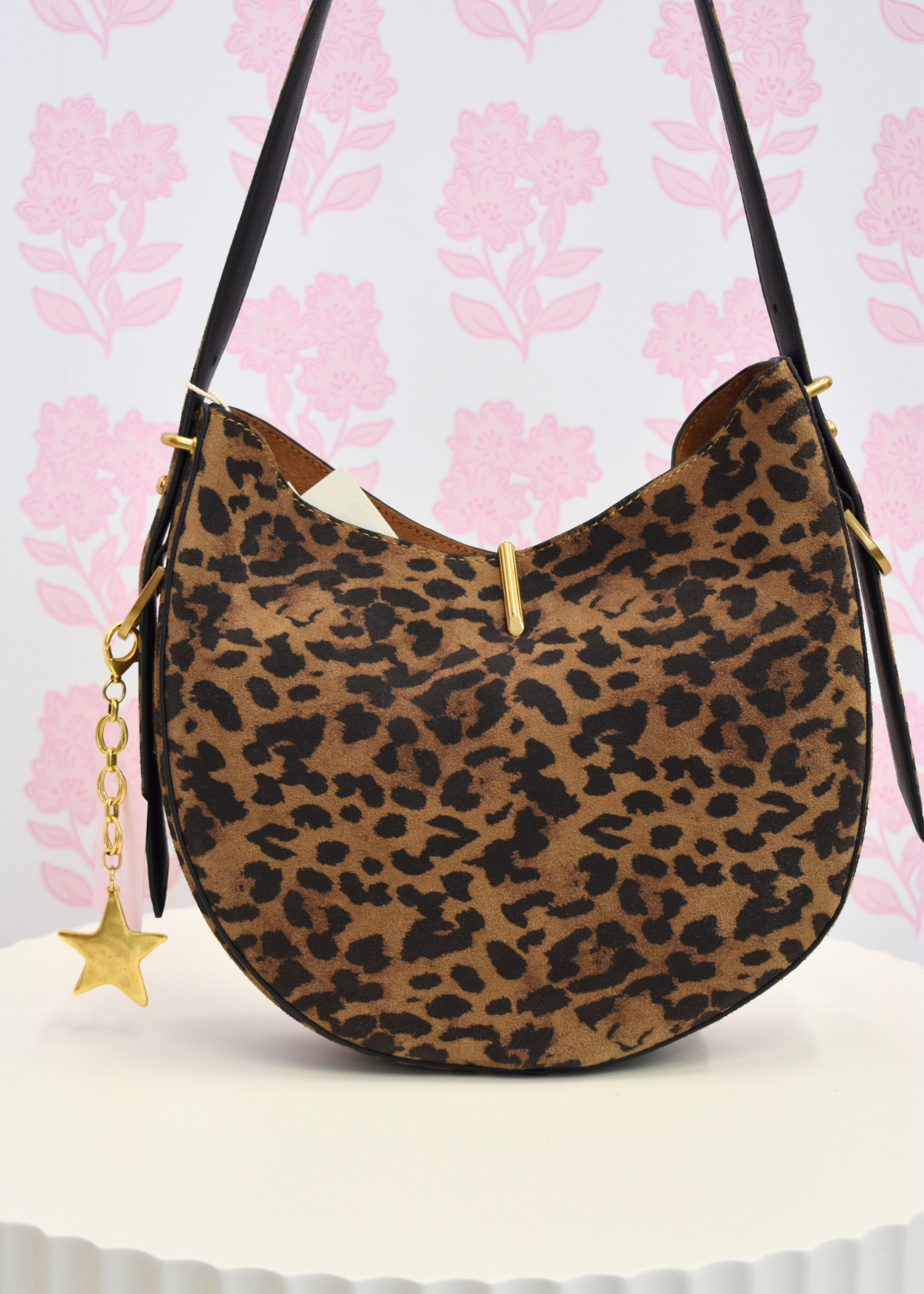 Bree leopard shoulder bag featuring gold hardware clasp