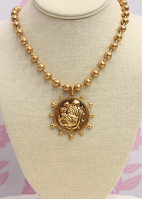 Layered gold bulldog coin necklaces with vintage style
