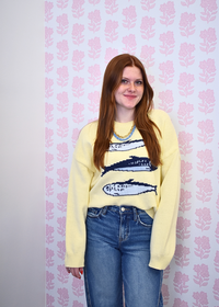 Butter yellow graphic sweater featuring three sardines design