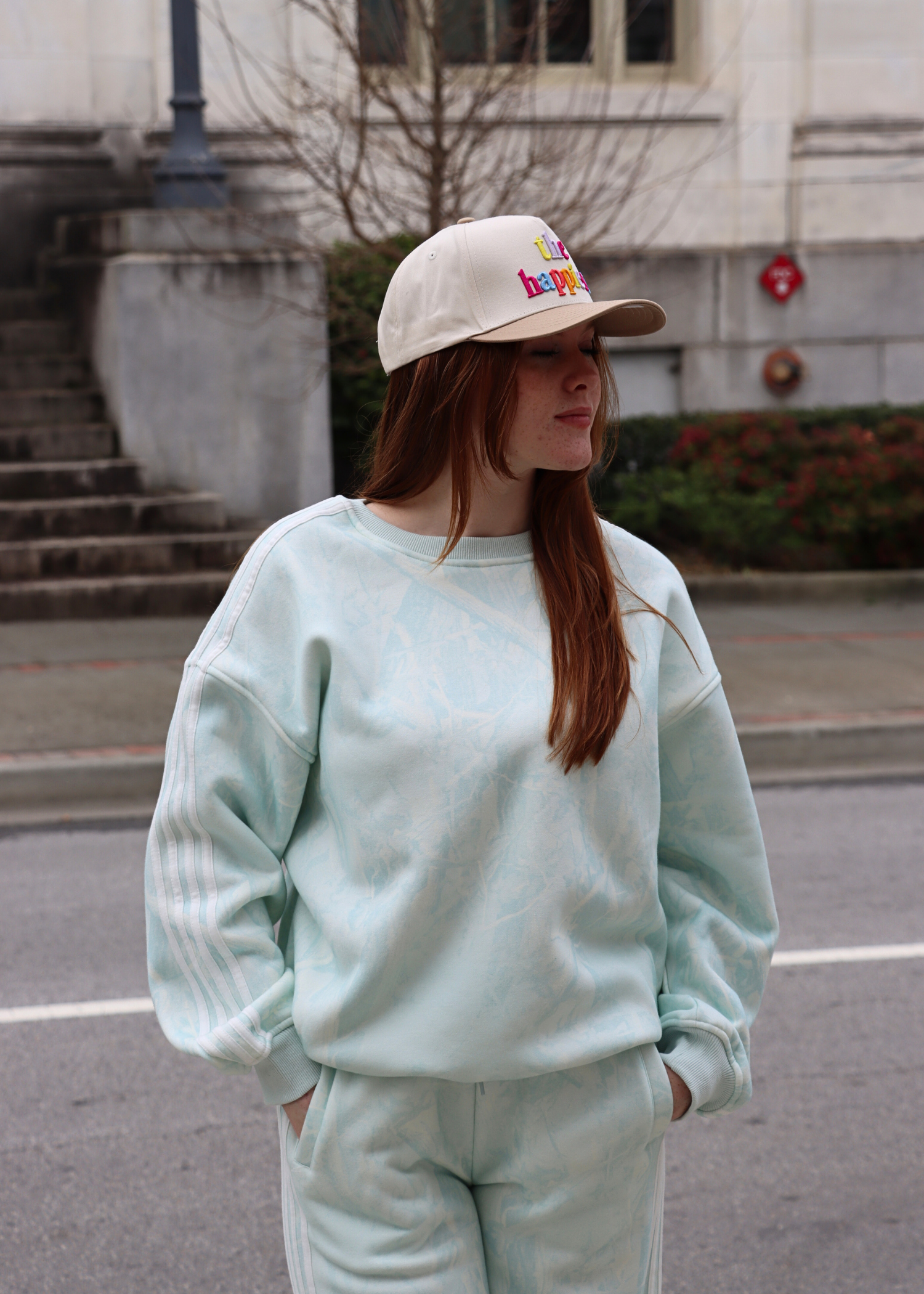Side view of mint camo sweatshirt with stripe detail