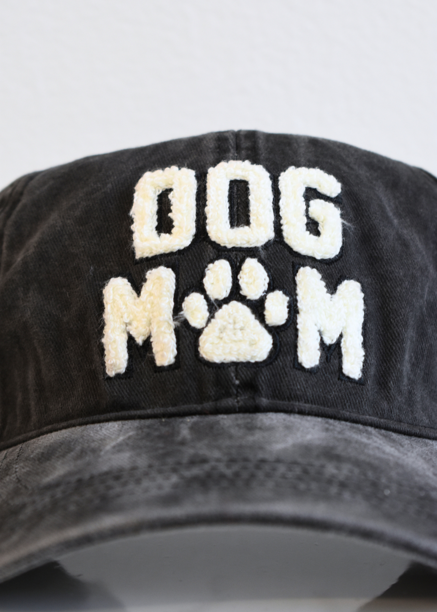 Washed black Dog Mom baseball cap styled with casual everyday outfit