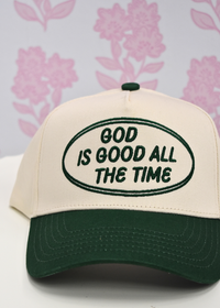 Green God is Good trucker hat styled as a thoughtful Christian gift