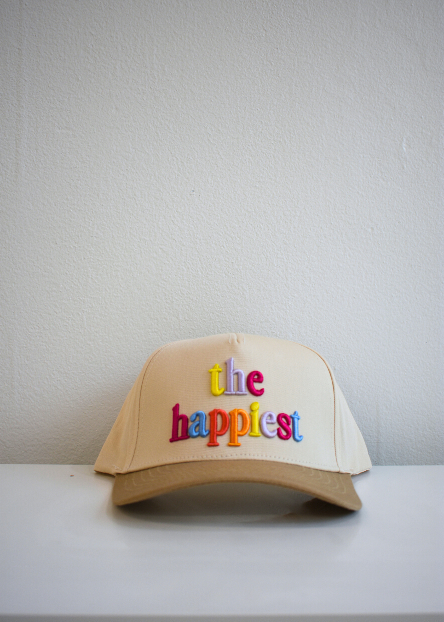 Multicolor 3D puff embroidery detail on vintage trucker hat