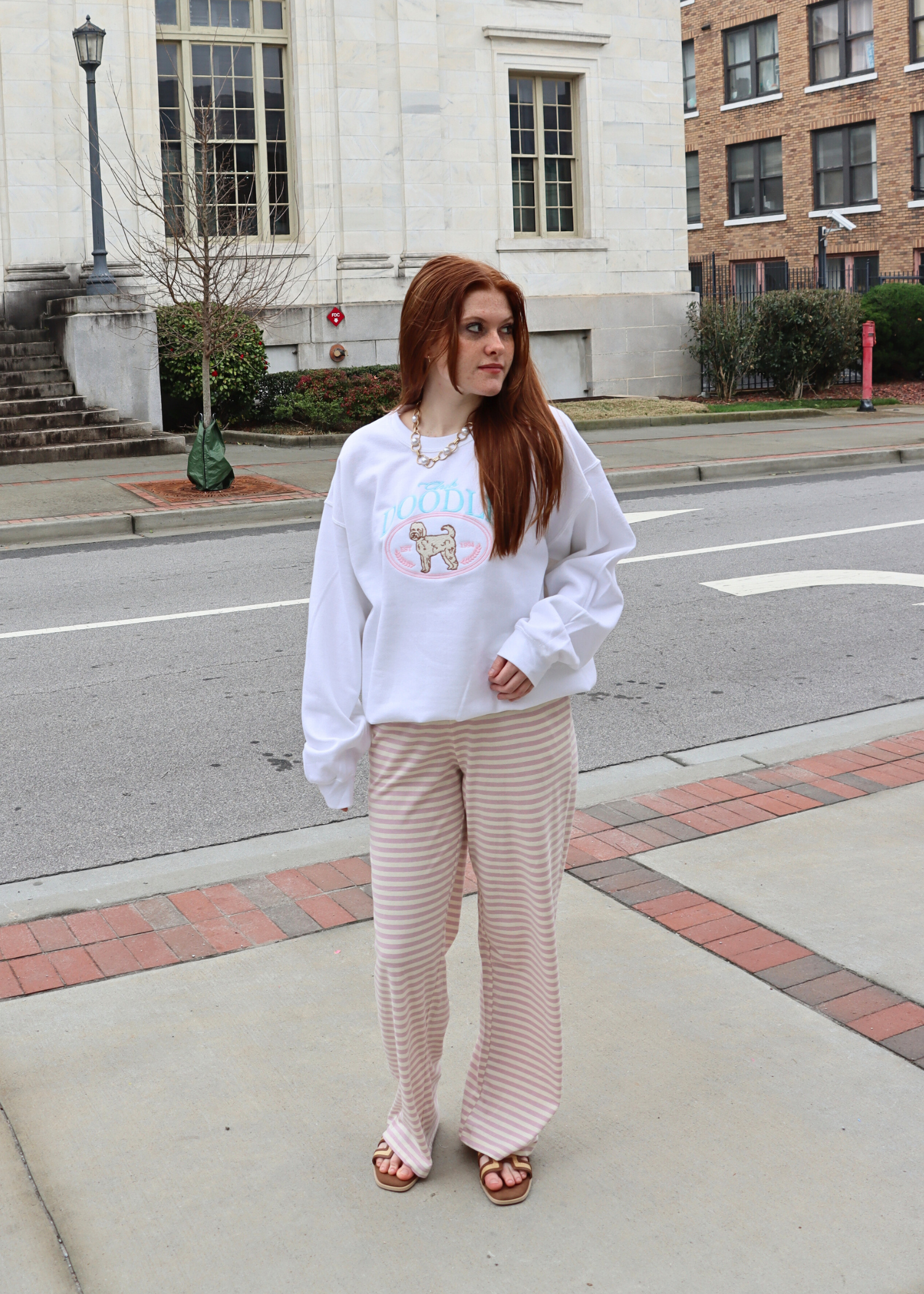 Club Doodle embroidered sweatshirt styled with striped lounge pants