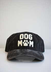 Front view of Dog Mom embroidered washed black baseball cap