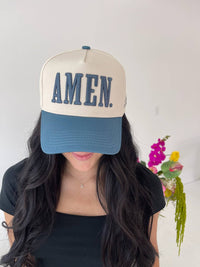 Close up of AMEN embroidery on slate blue trucker hat