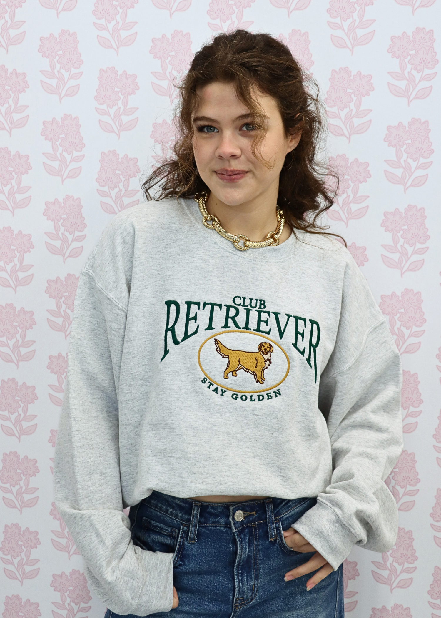Front view of embroidered retriever club sweatshirt for women