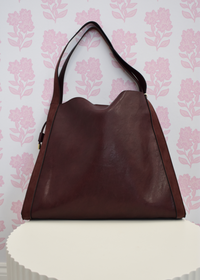 Burgundy shoulder bag with structured silhouette for everyday wear