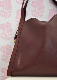 Fallon burgundy shoulder bag styled with outfit