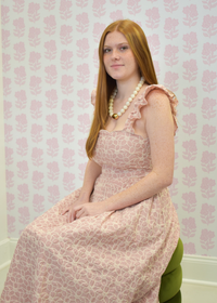 Romantic blush midi dress with subtle cutout accen