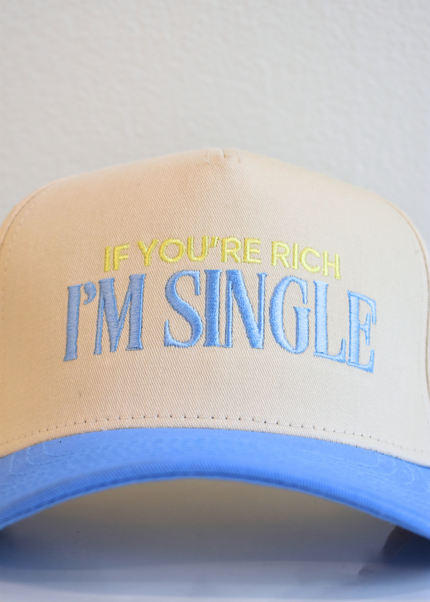 Periwinkle and natural snapback hat reading If You’re Rich I’m Single