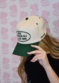 Side view of green vintage trucker hat with inspirational message with Grateful