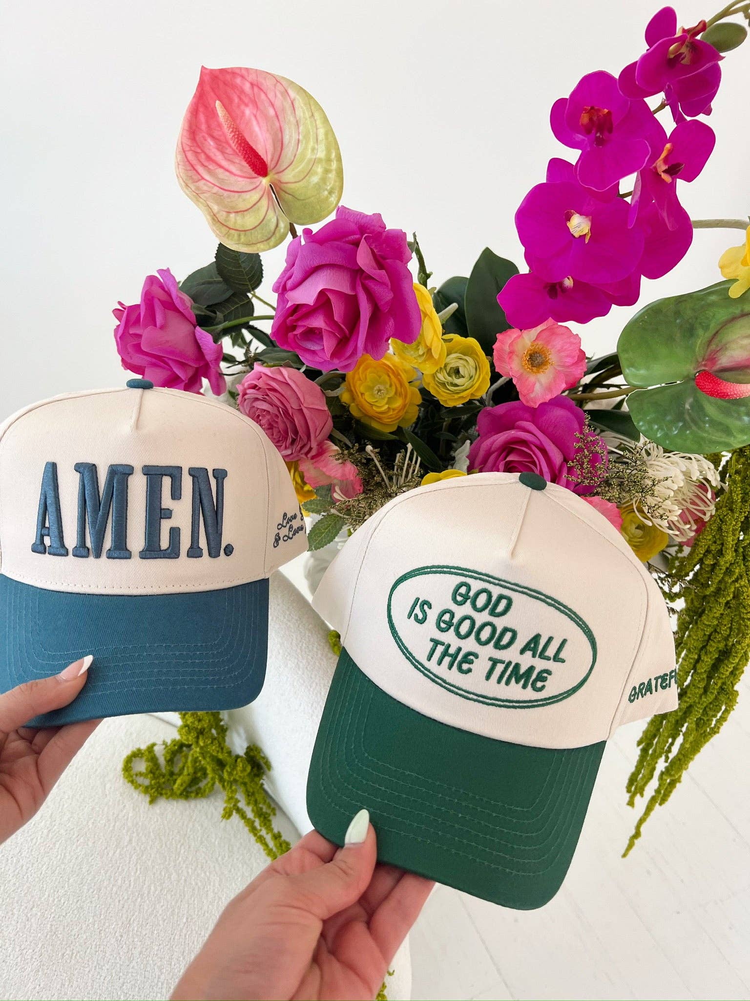 Side view of green vintage trucker hat with inspirational message