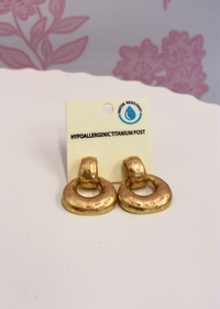 Textured gold door knocker earrings with hammered finish