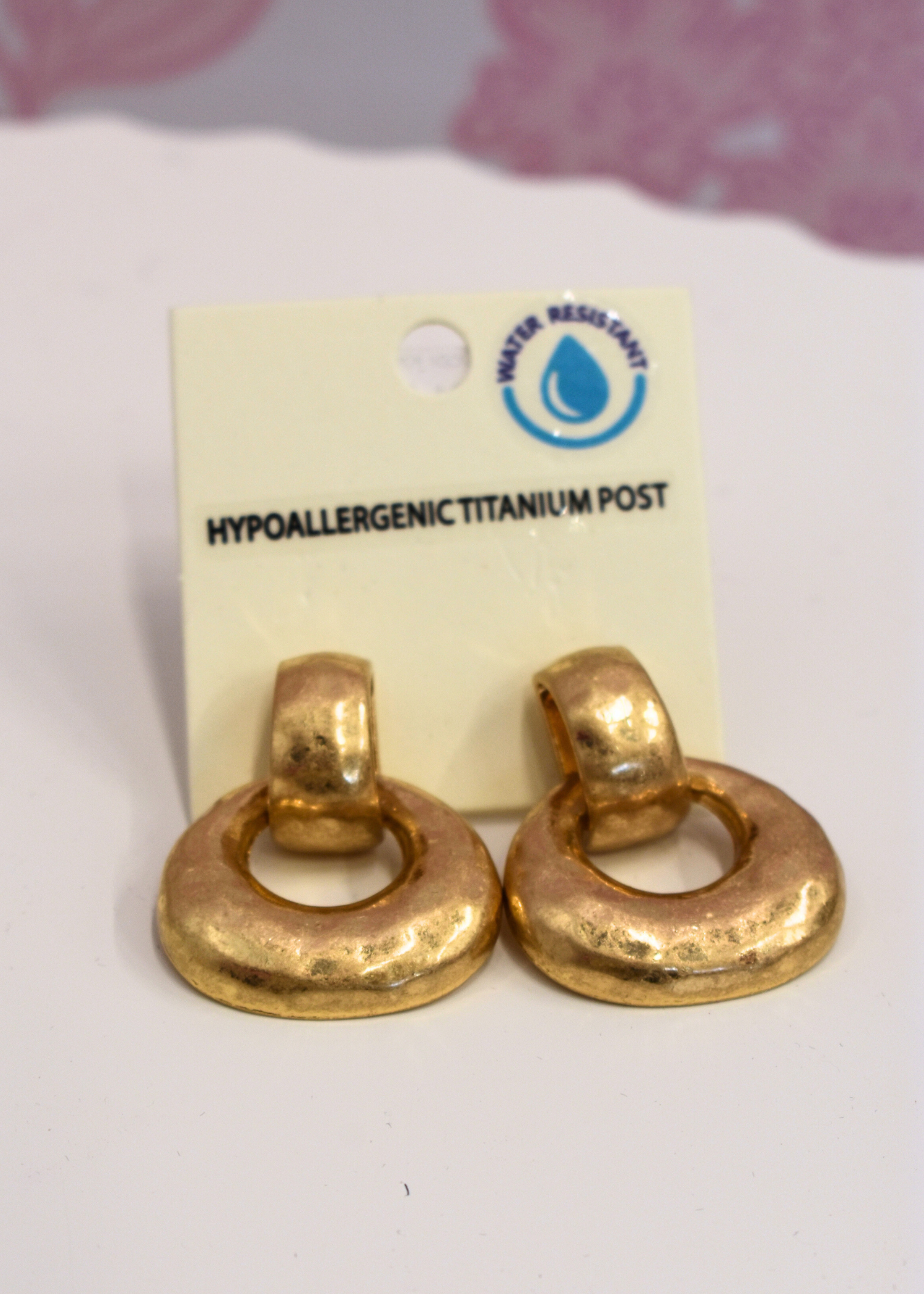 Gold hammered door knocker earrings with gradual design