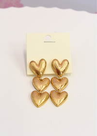 Three tier puffy heart dangle earrings in vintage gold