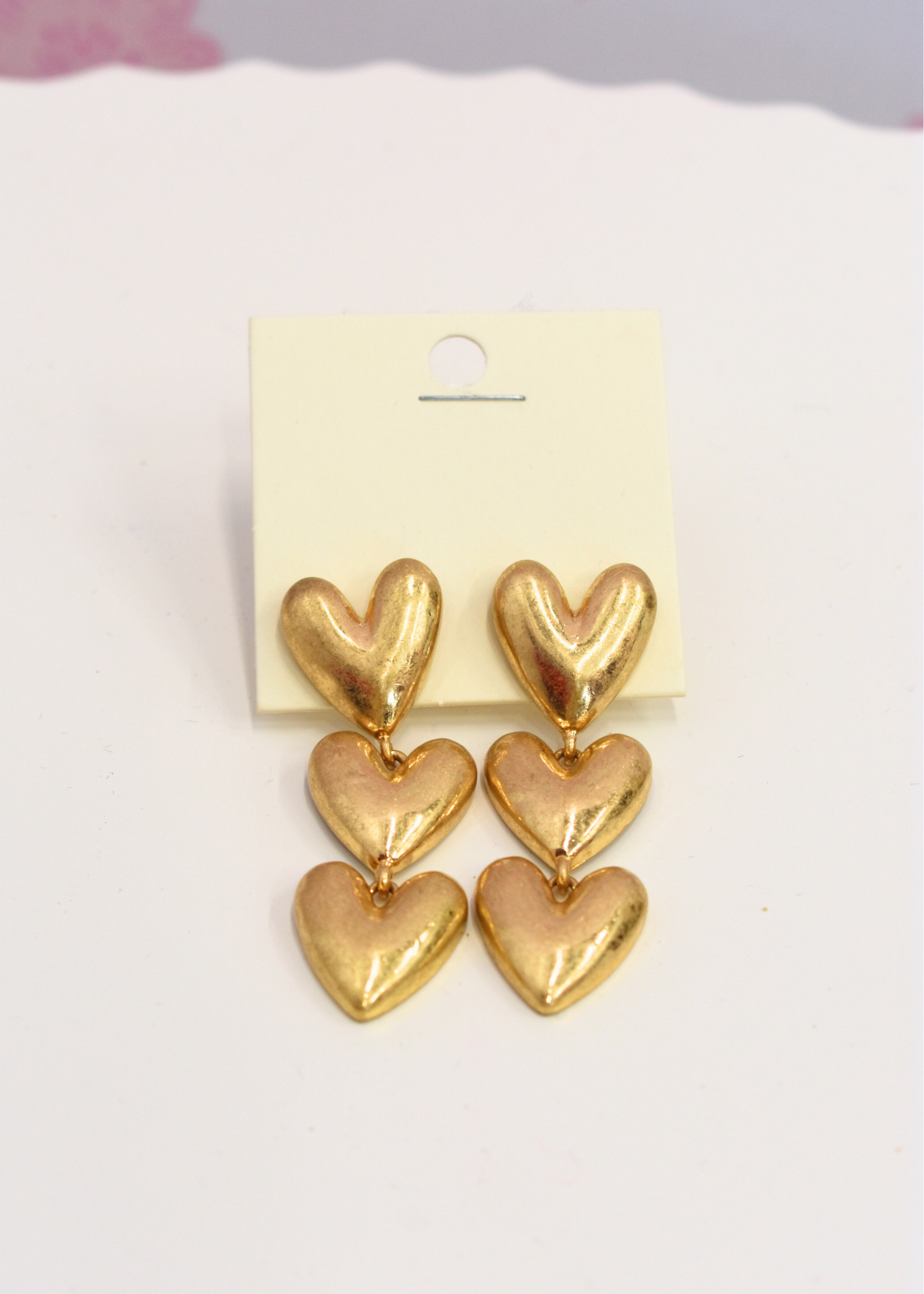 Three tier puffy heart dangle earrings in vintage gold