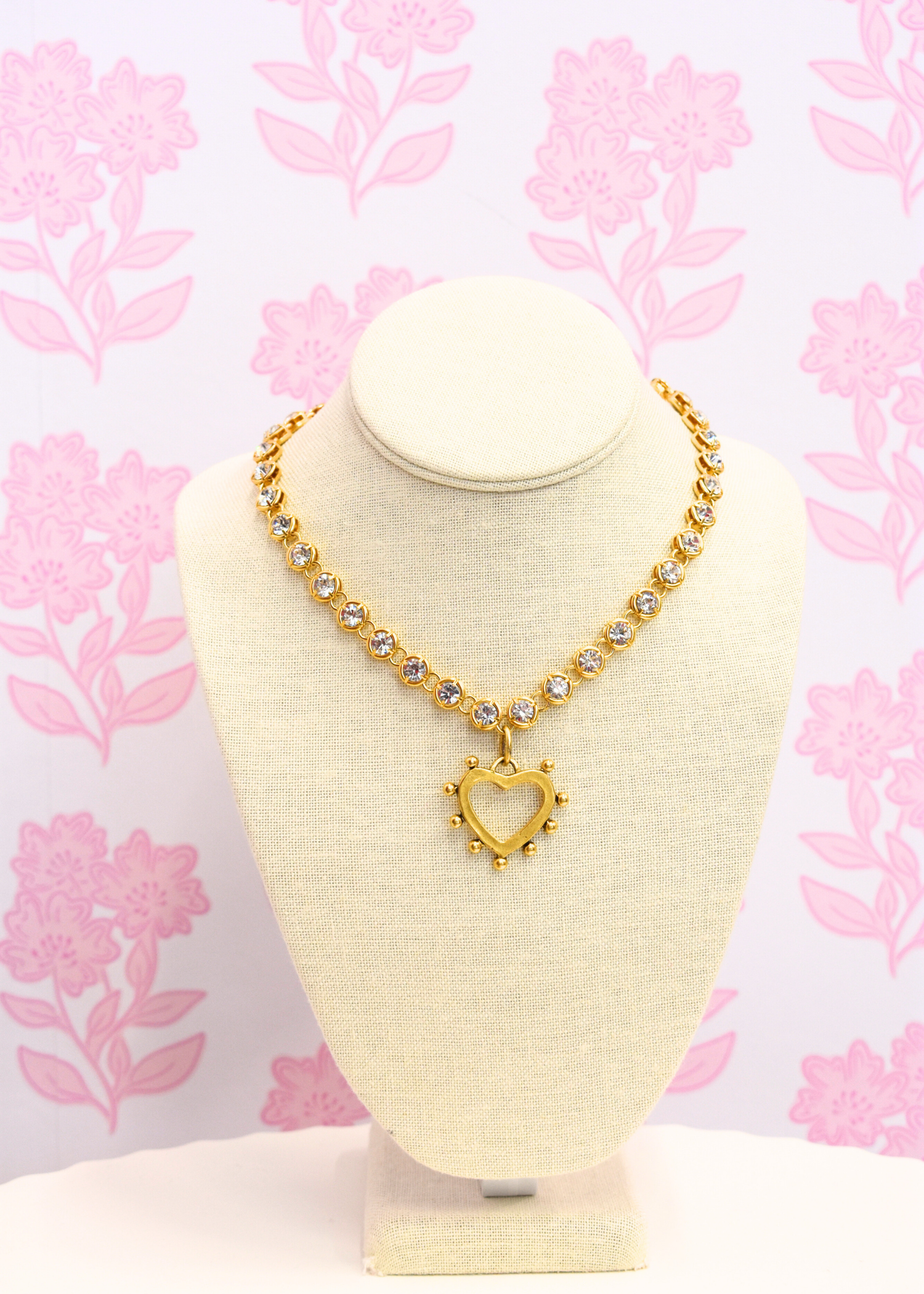 Gold heart pendant necklace with shimmering sparkle chain