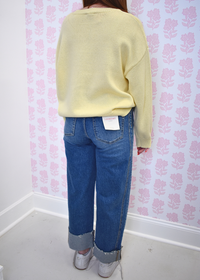 High rise barrel style jeans featuring distressed cuffed bottoms