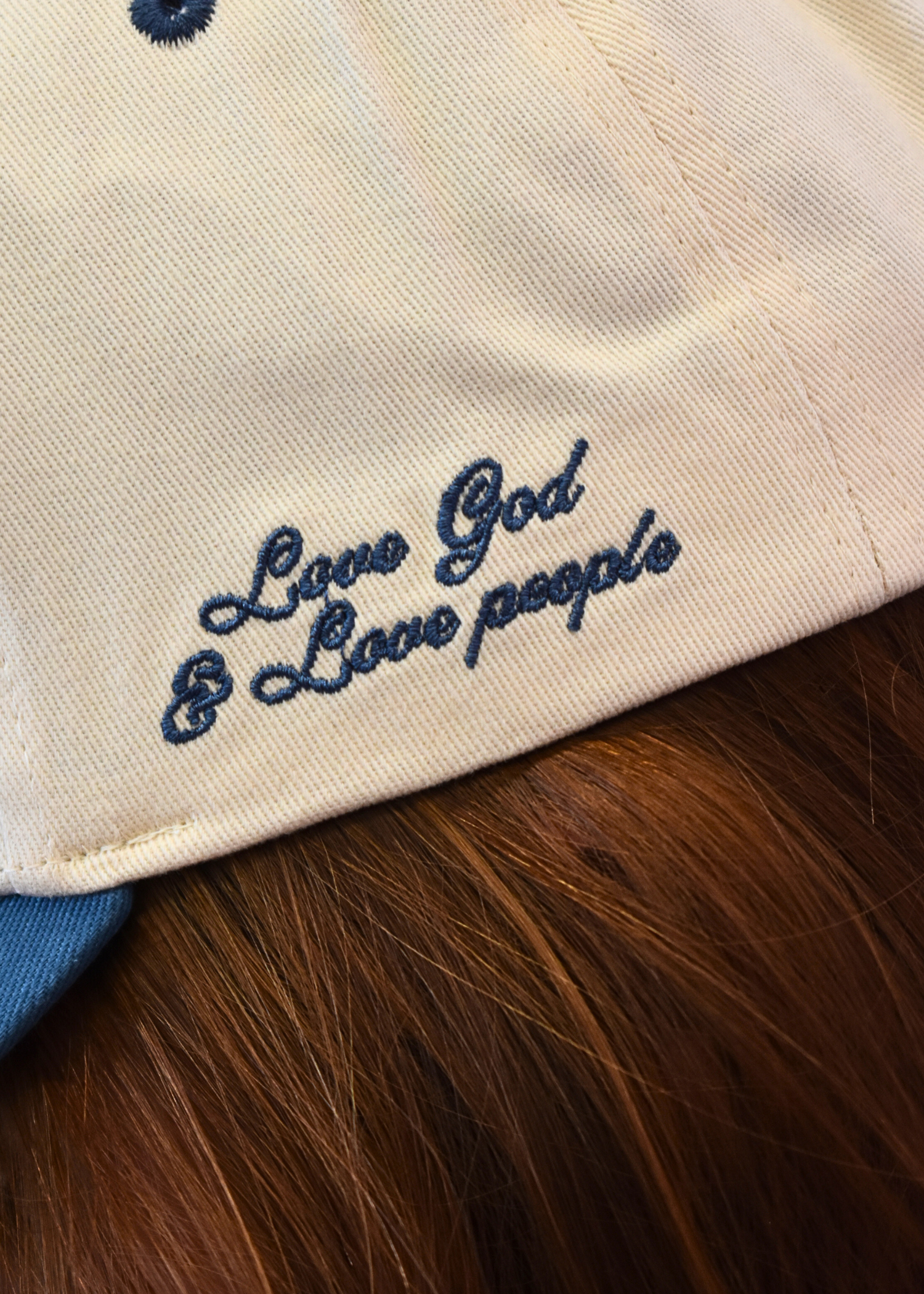 Slate blue AMEN trucker hat styled with casual boutique outfit