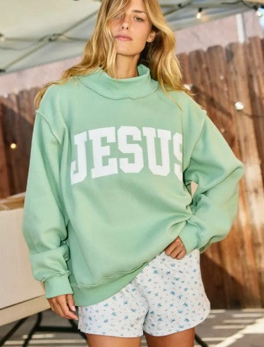 Sage green mockneck sweatshirt with white Jesus graphic print
