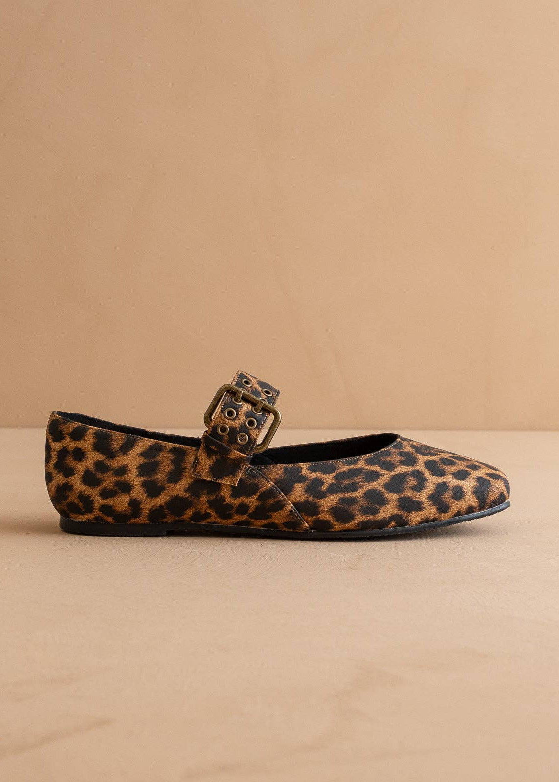 Side view of leopard print ballet flat with buckle detail