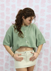 Light green short sleeve sweater cardigan styled with casual outfit