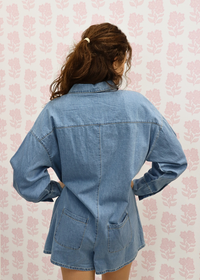 Close up of denim fabric on long sleeve romper
