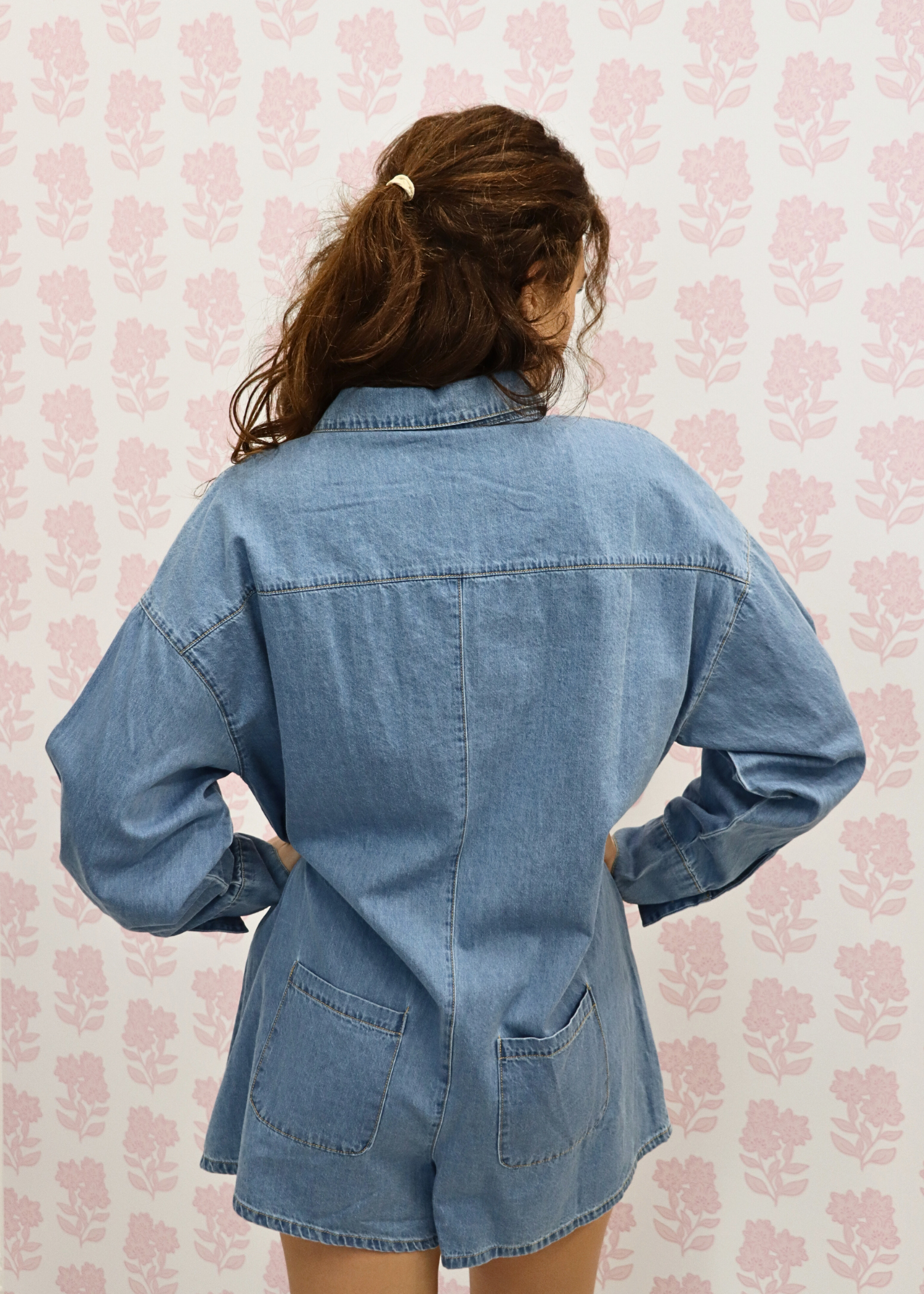 Close up of denim fabric on long sleeve romper