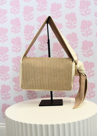 Ivory shoulder bag with faux leather and raffia design