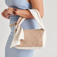 Neutral ivory shoulder bag styled for everyday wear