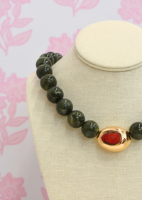 Organic style necklace featuring polished green marble stone