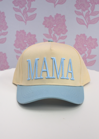 Front view of baby blue MAMA trucker hat with breathable mesh panel