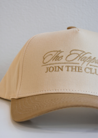 The Happiest tan and natural vintage trucker hat styled with casual neutral outfit