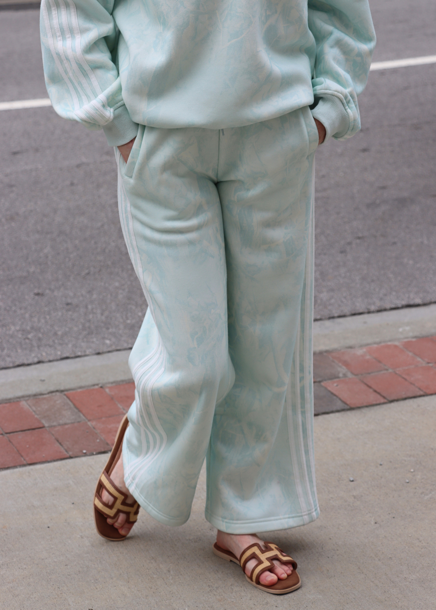 Front view of mint camo side stripe sweatpants for women