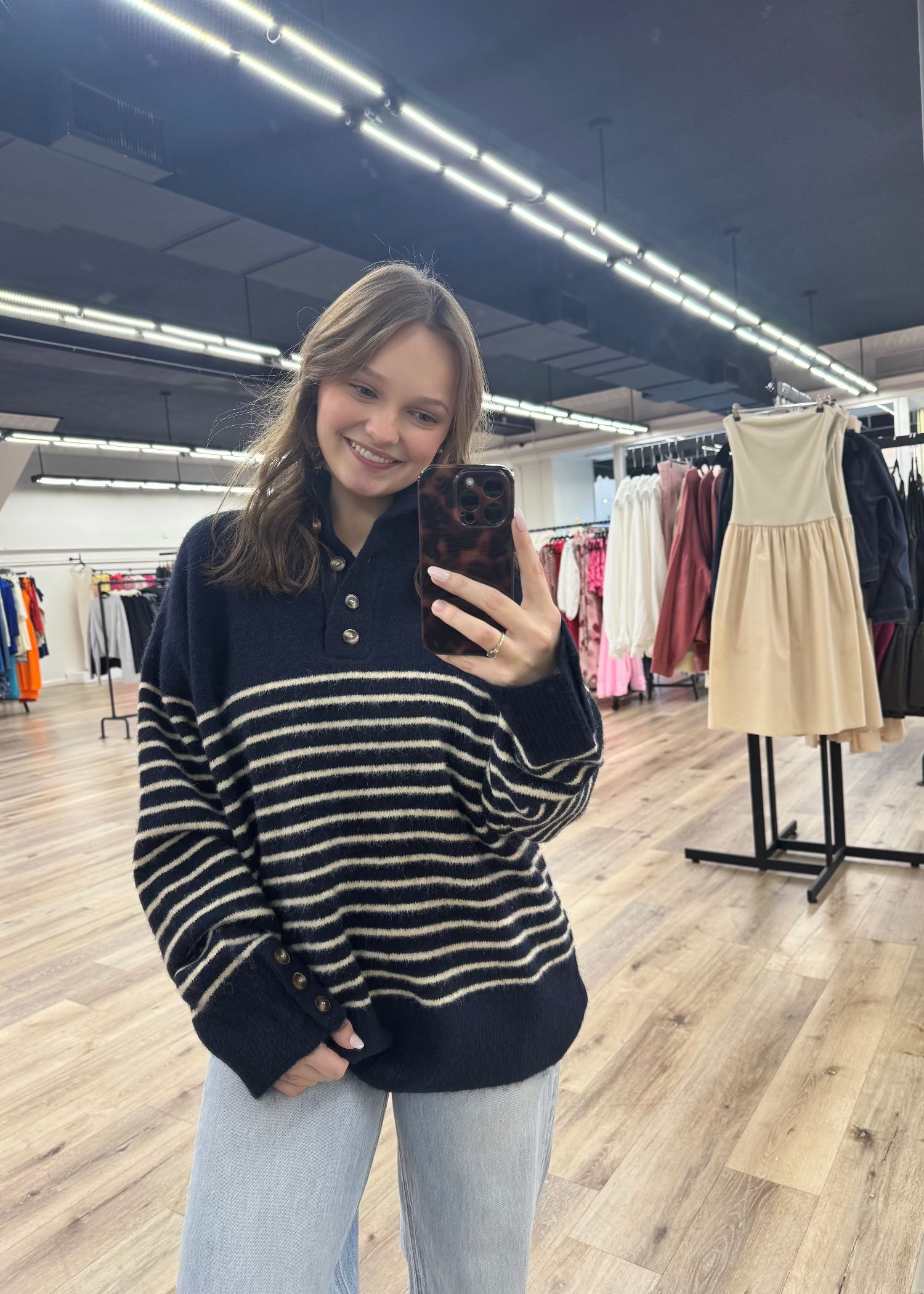 Striped Navy sweater with four buttons at the neck