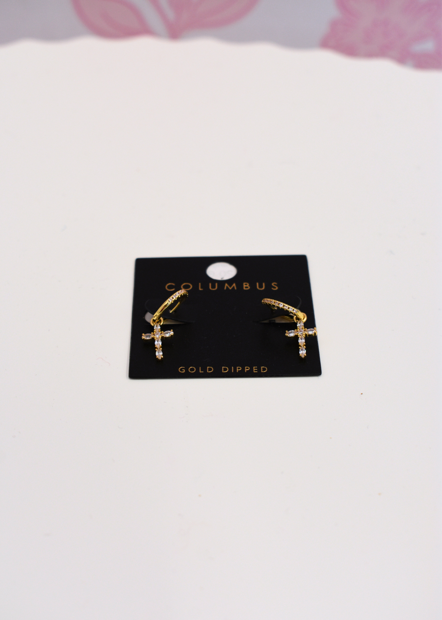 Cross dangle earrings featuring pavé cubic zirconia detail
